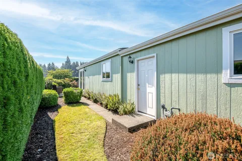 a balcony with furniture and a potted plant