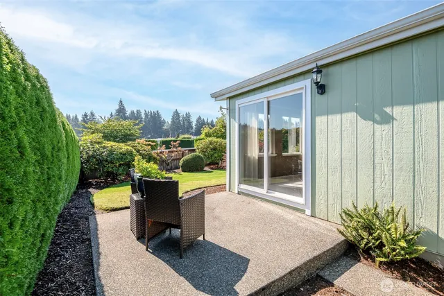 a view of a garden with a building in the background