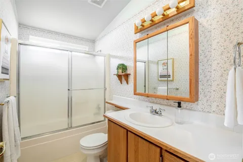 an aerial view of a house with a swimming pool