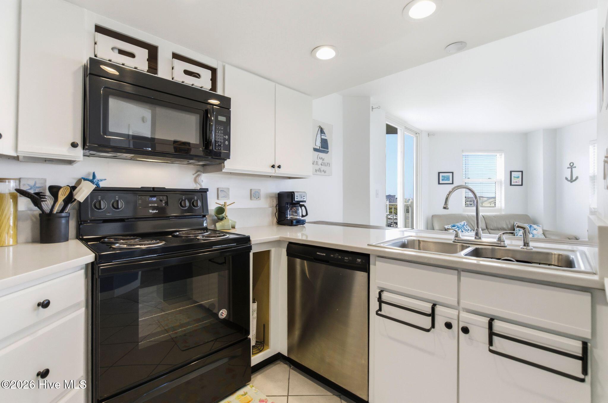 2000 New River Inlet Road, Unit 3201 North Topsail Beach, NC 28460 - Photo 11 of 65 White cabinets and countertops