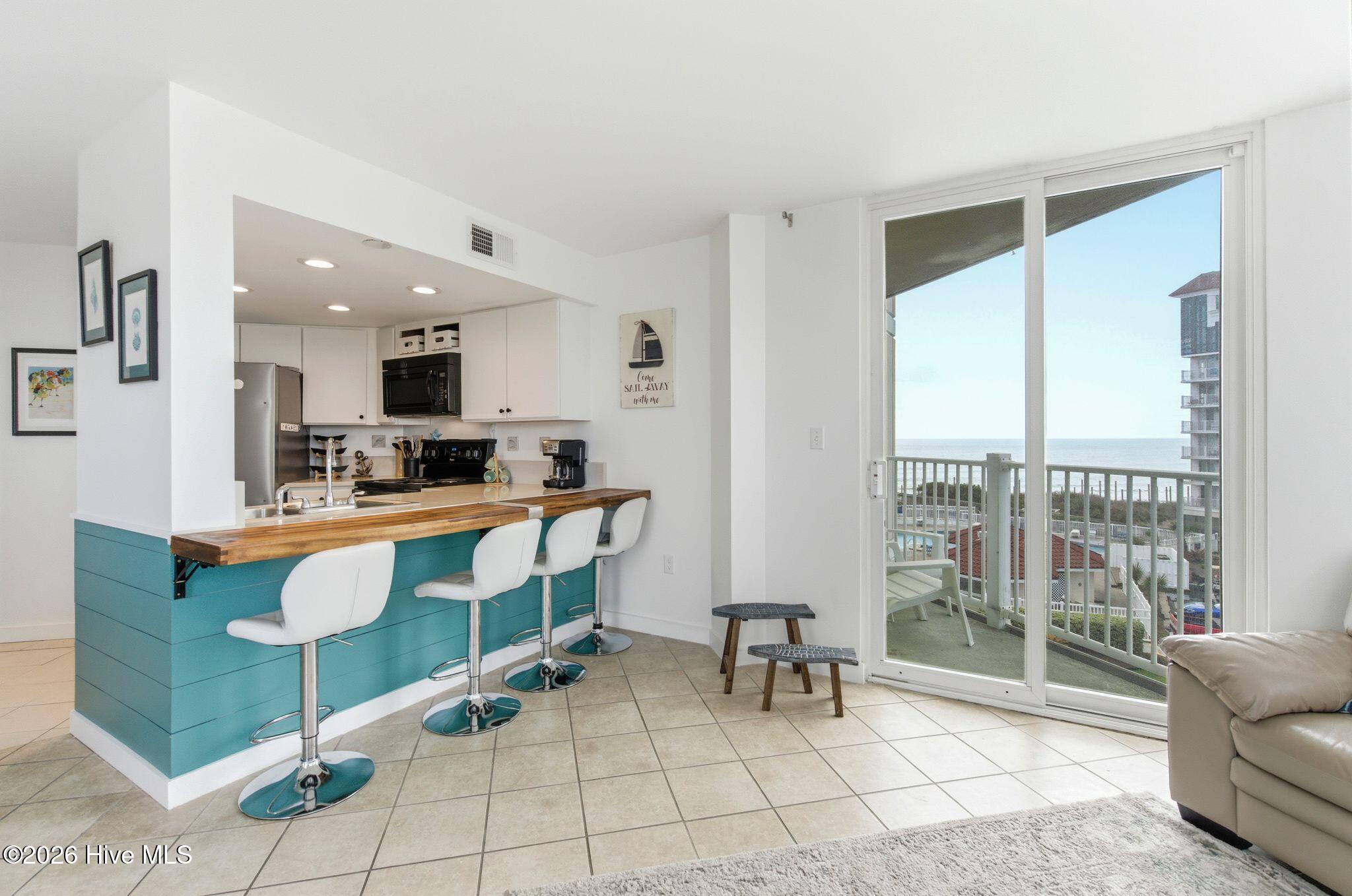 2000 New River Inlet Road, Unit 3201 North Topsail Beach, NC 28460 - Photo 17 of 65 Glass doors to Balcony