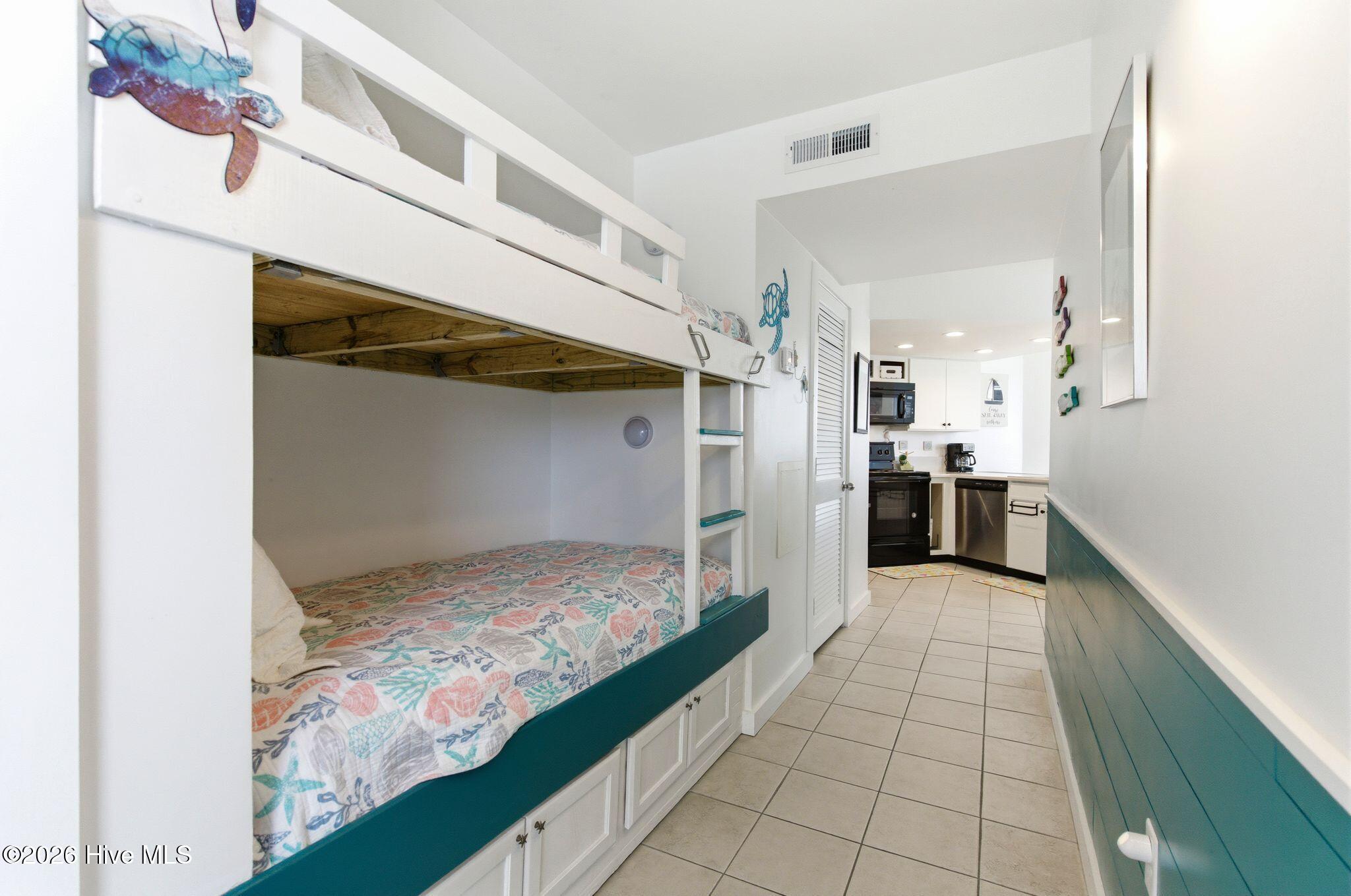 2000 New River Inlet Road, Unit 3201 North Topsail Beach, NC 28460 - Photo 4 of 65 Hall with reinforced bunk beds and wainscoting