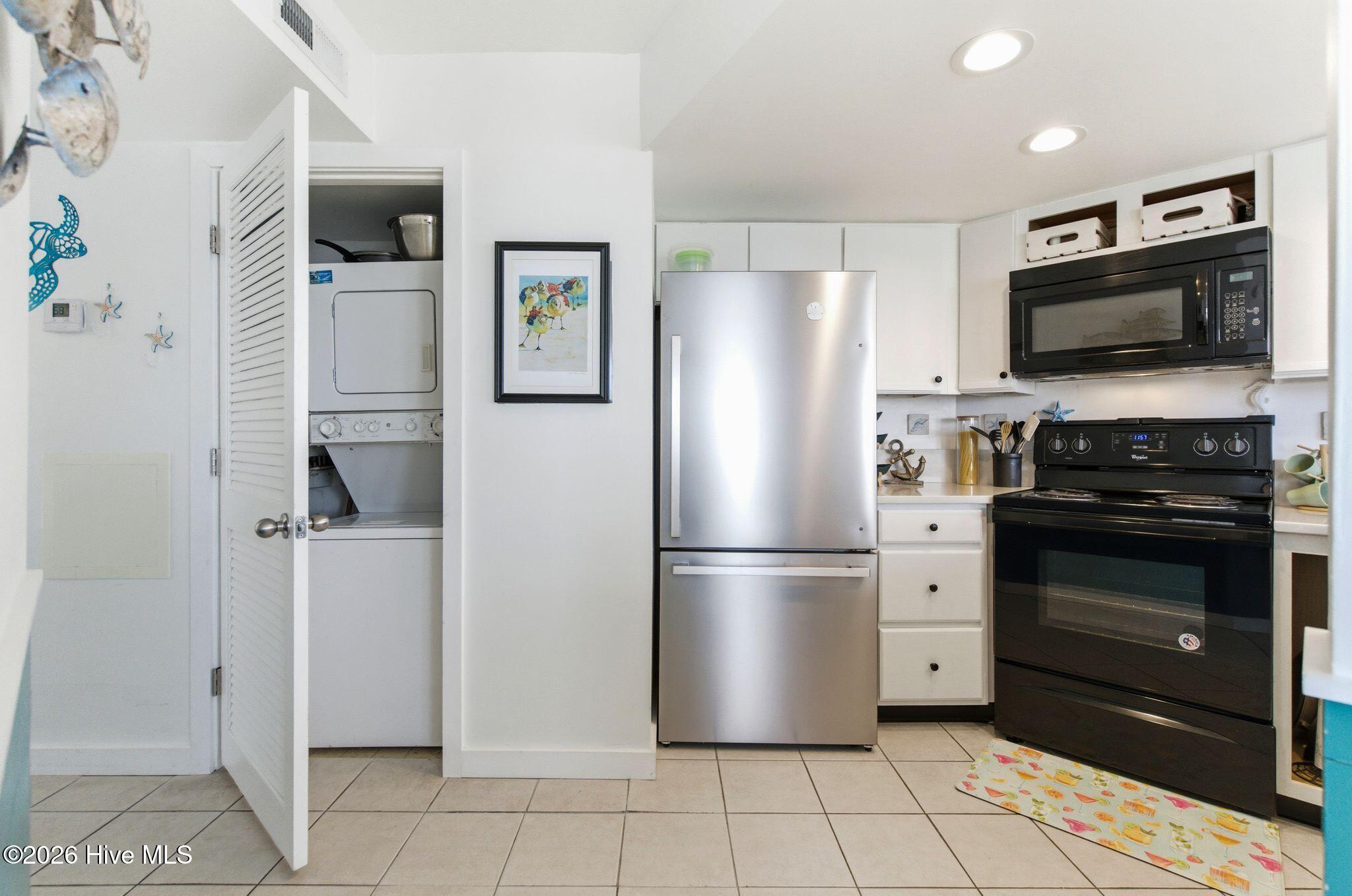 2000 New River Inlet Road, Unit 3201 North Topsail Beach, NC 28460 - Photo 8 of 65 Stack Washer/Dryer beside Kitchen
