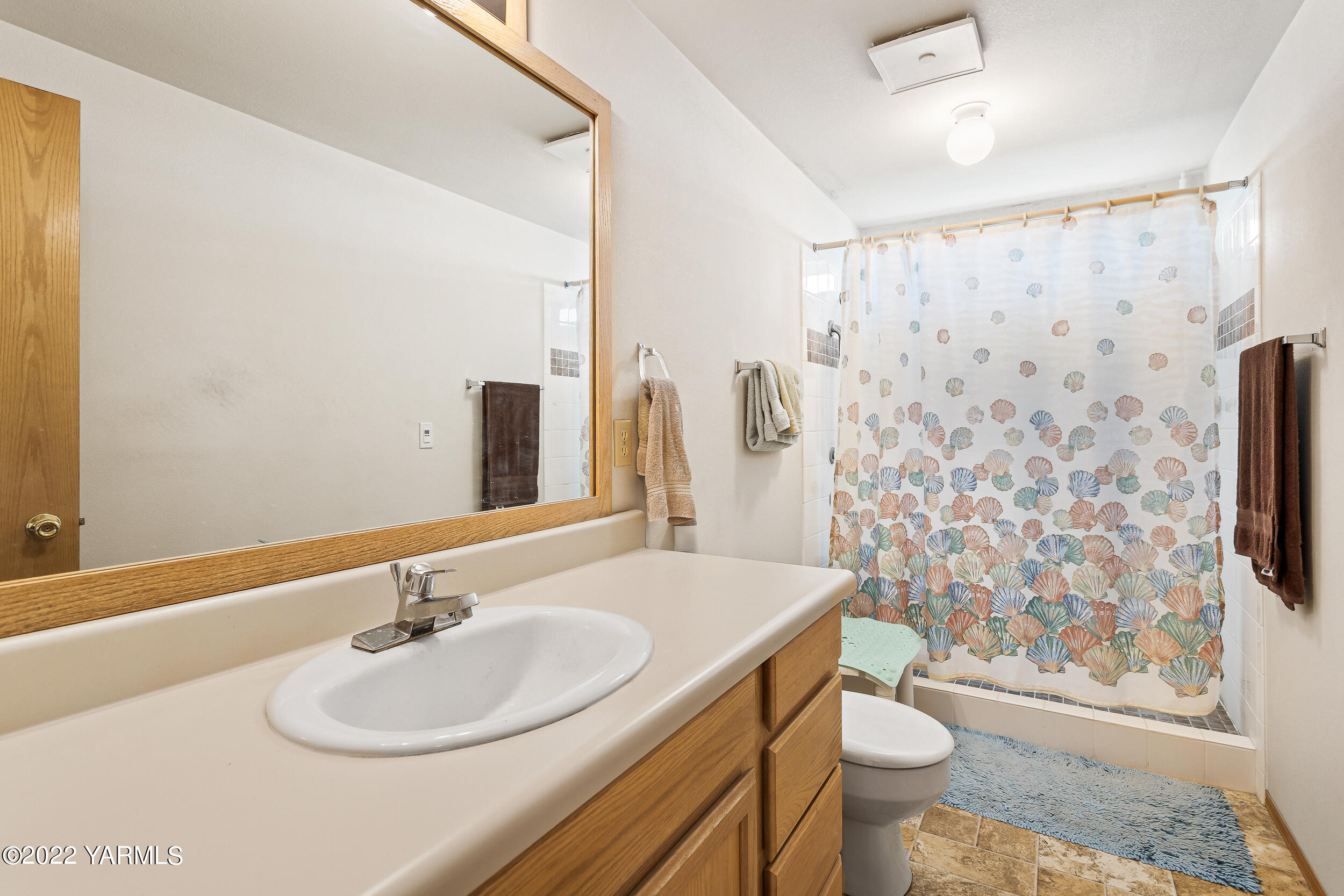 1607 Beaudry Road Yakima, WA 98901 - Photo 23 of 45 a bathroom with a sink toilet and shower