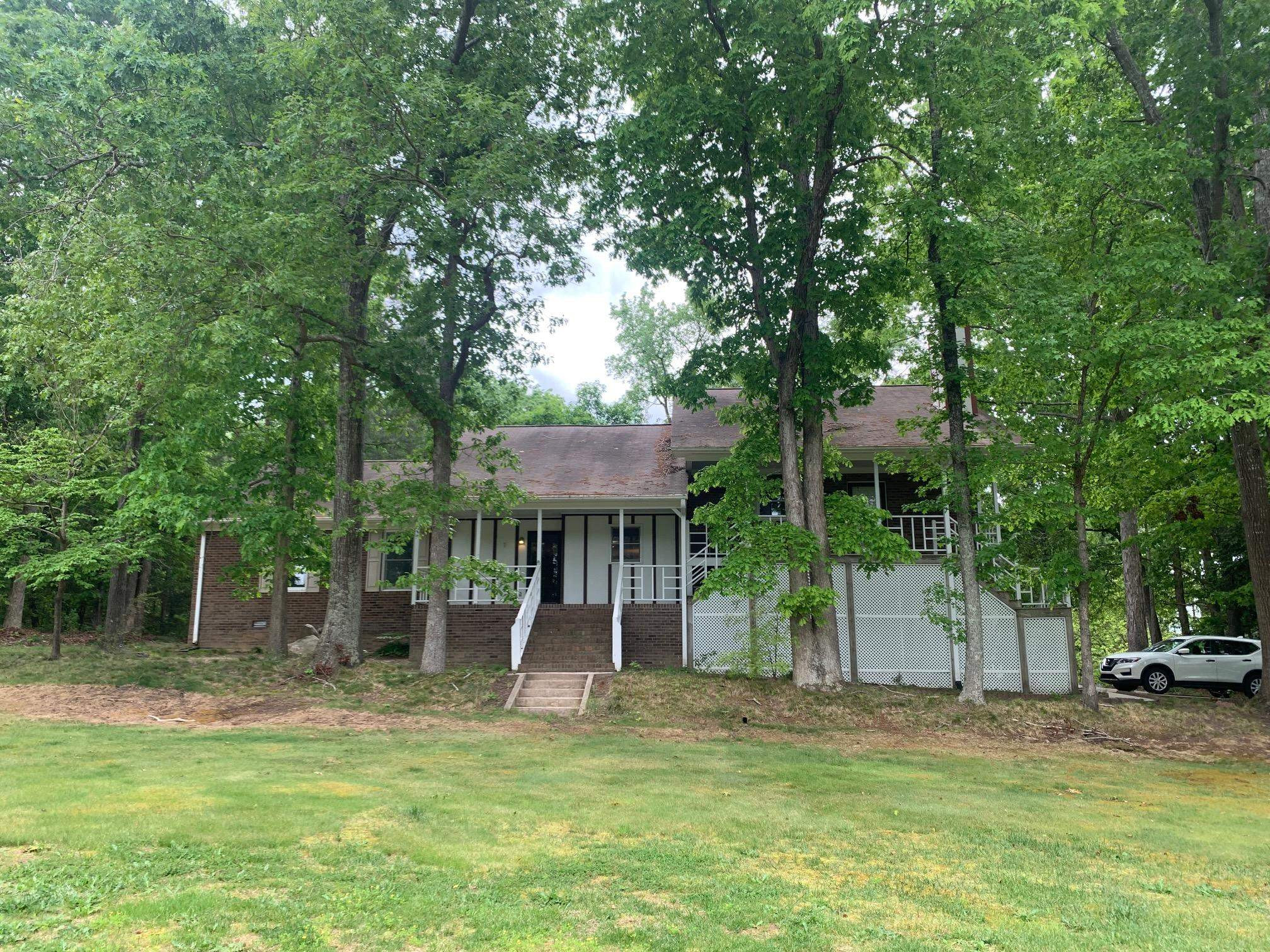 3024 Old Crews Road Raleigh, NC 27616 - Photo 1 of 13 a view of a house with a backyard and a tree