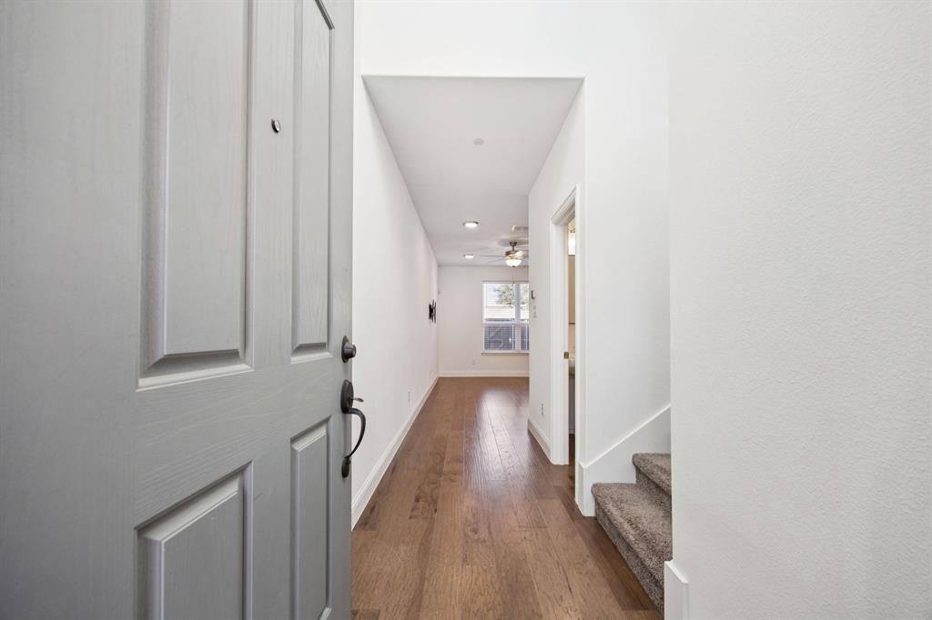 964 Emil Place Allen, TX 75013 - Photo 13 of 25 a view of a hallway with wooden floor and staircase