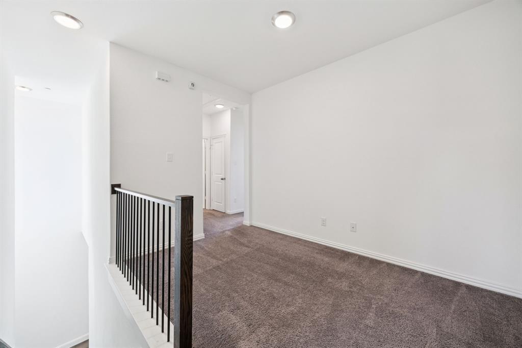 964 Emil Place Allen, TX 75013 - Photo 14 of 25 a view of a room with wooden floor