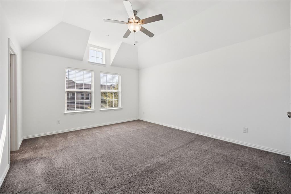 964 Emil Place Allen, TX 75013 - Photo 16 of 25 an empty room with windows and fan
