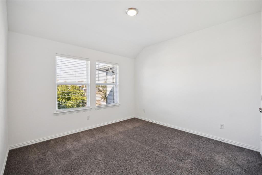 964 Emil Place Allen, TX 75013 - Photo 21 of 25 an empty room with windows