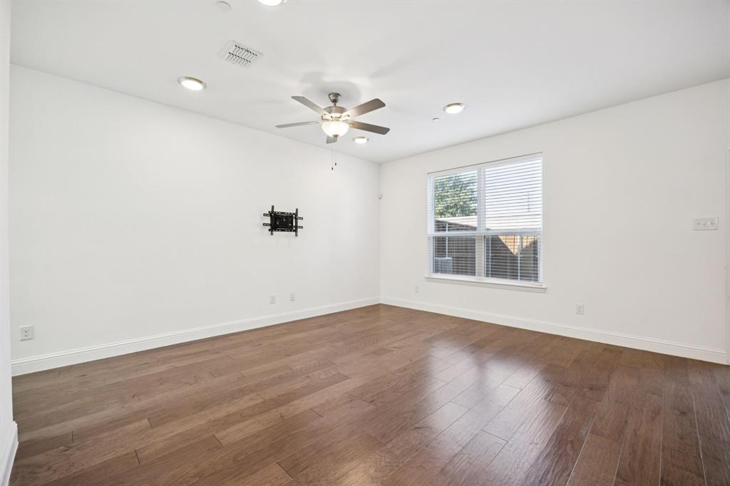 964 Emil Place Allen, TX 75013 - Photo 5 of 25 wooden floor in an empty room with a window