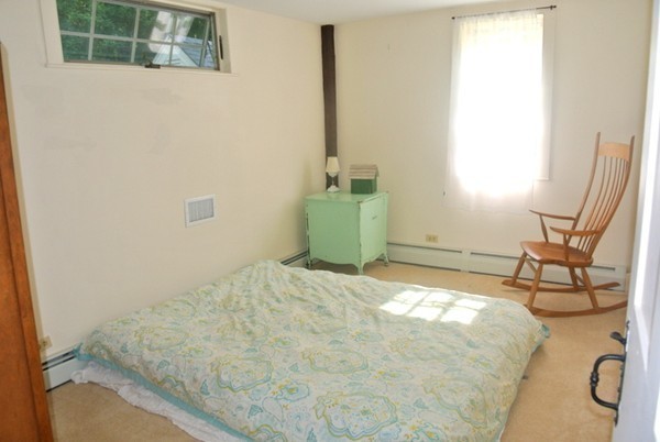 127 Beaman Road Sterling, MA 01564 - Photo 23 of 29 a bedroom with a bed and wooden floor