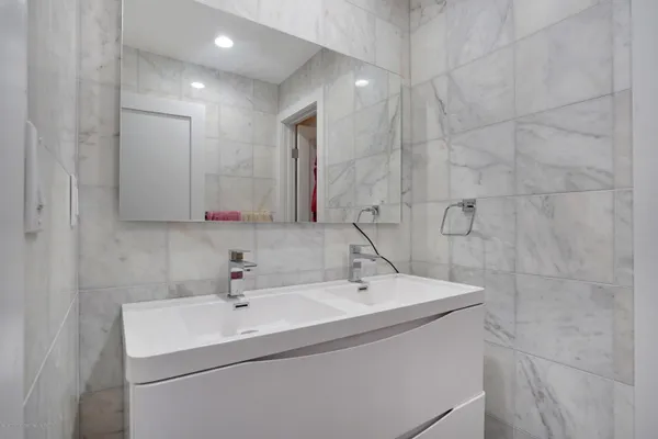 a bathroom with a sink and a mirror