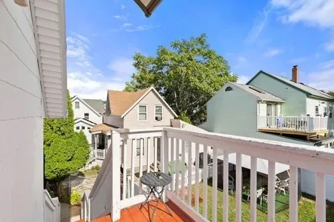 a view of a house with wooden fence