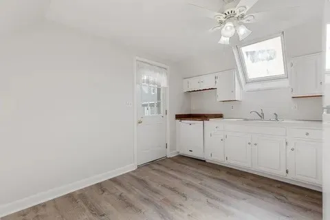 a view of a kitchen with granite countertop cabinets and a sink