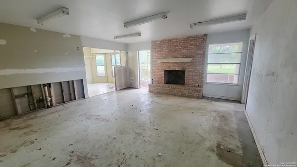 a kitchen with a sink cabinets and appliances