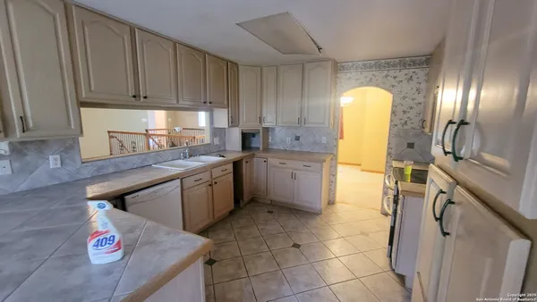 a view of a bathroom with a sink and a mirror