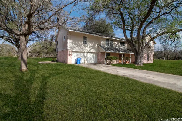 a view of house with yard
