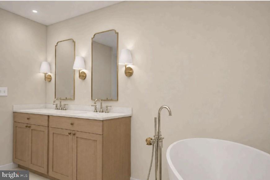205 MacArthur Road Alexandria, VA 22305 - Photo 10 of 23 a bathroom with a double vanity sink and a mirror