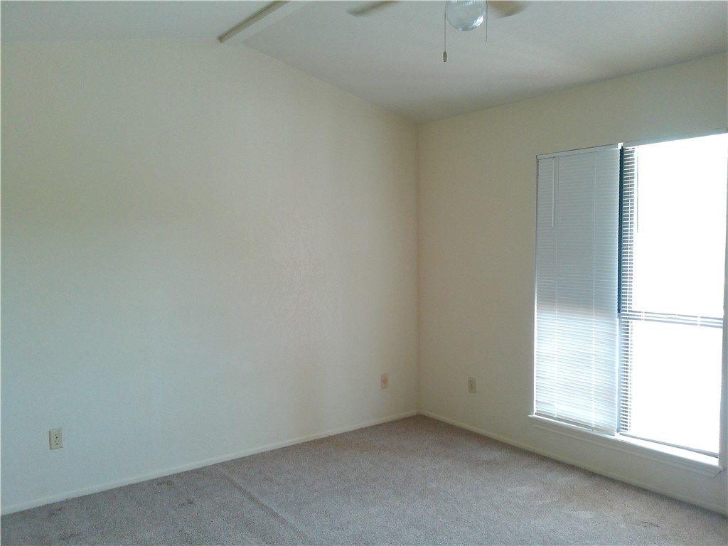 2936 St Joseph Street, Unit B Corpus Christi, TX 78418 - Photo 11 of 15 an empty room with a window