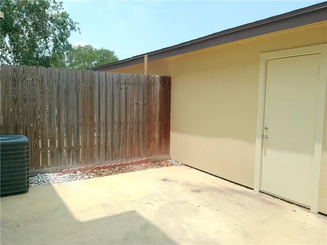 a view of a backyard of the house