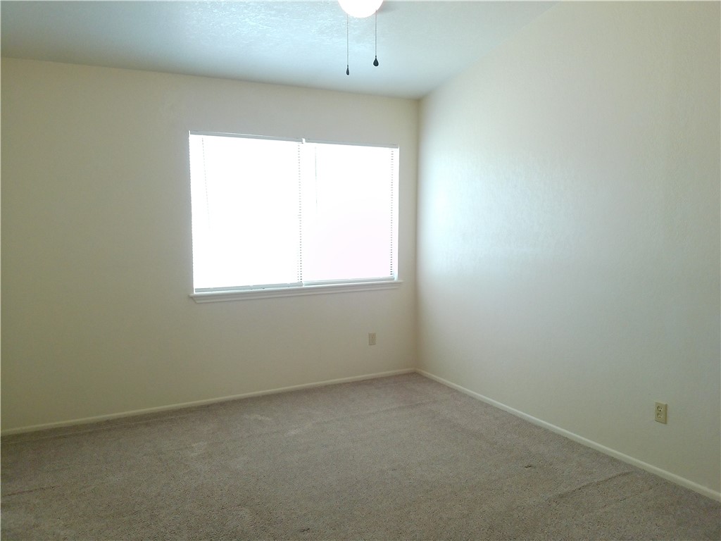 2936 St Joseph Street, Unit B Corpus Christi, TX 78418 - Photo 8 of 15 an empty room with a window