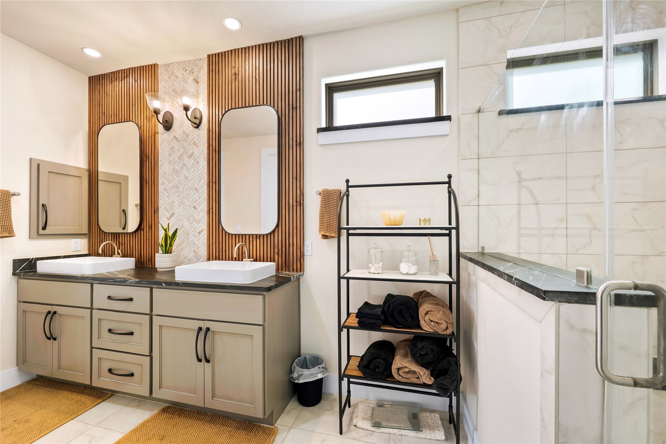 2408 Nate's Place Georgetown, TX 78633 - Photo 20 of 40 Indulge in a tranquil retreat with dual sinks, modern vanities, and a luxurious walk-in shower.