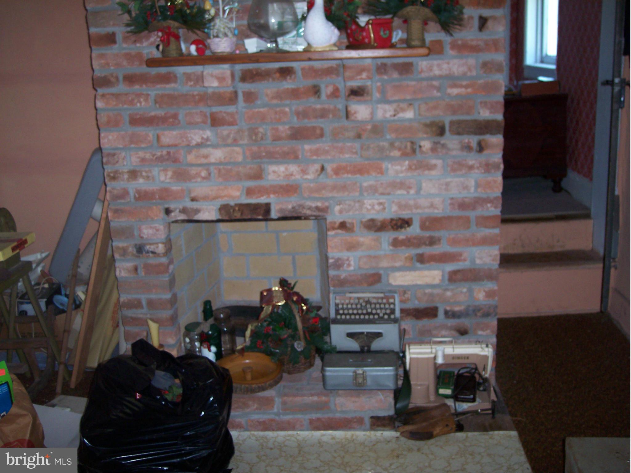 3468 Uniontown Road Westminster, MD 21158 - Photo 14 of 21 a room with furniture and a fireplace