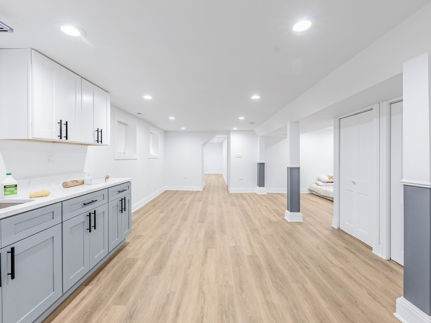 7755 South Wolcott Avenue Chicago, IL 60620 - Photo 27 of 39 a large kitchen with a lot of counter space and wooden floor
