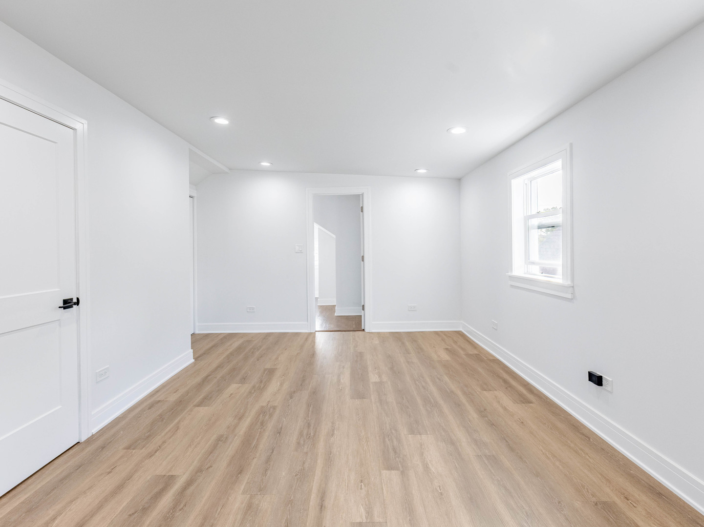 7755 South Wolcott Avenue Chicago, IL 60620 - Photo 33 of 39 a view of an empty room with wooden floor and a window
