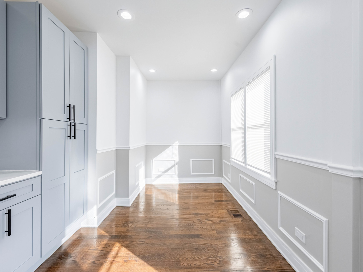 7755 South Wolcott Avenue Chicago, IL 60620 - Photo 8 of 39 a view of wooden floor and windows in a room