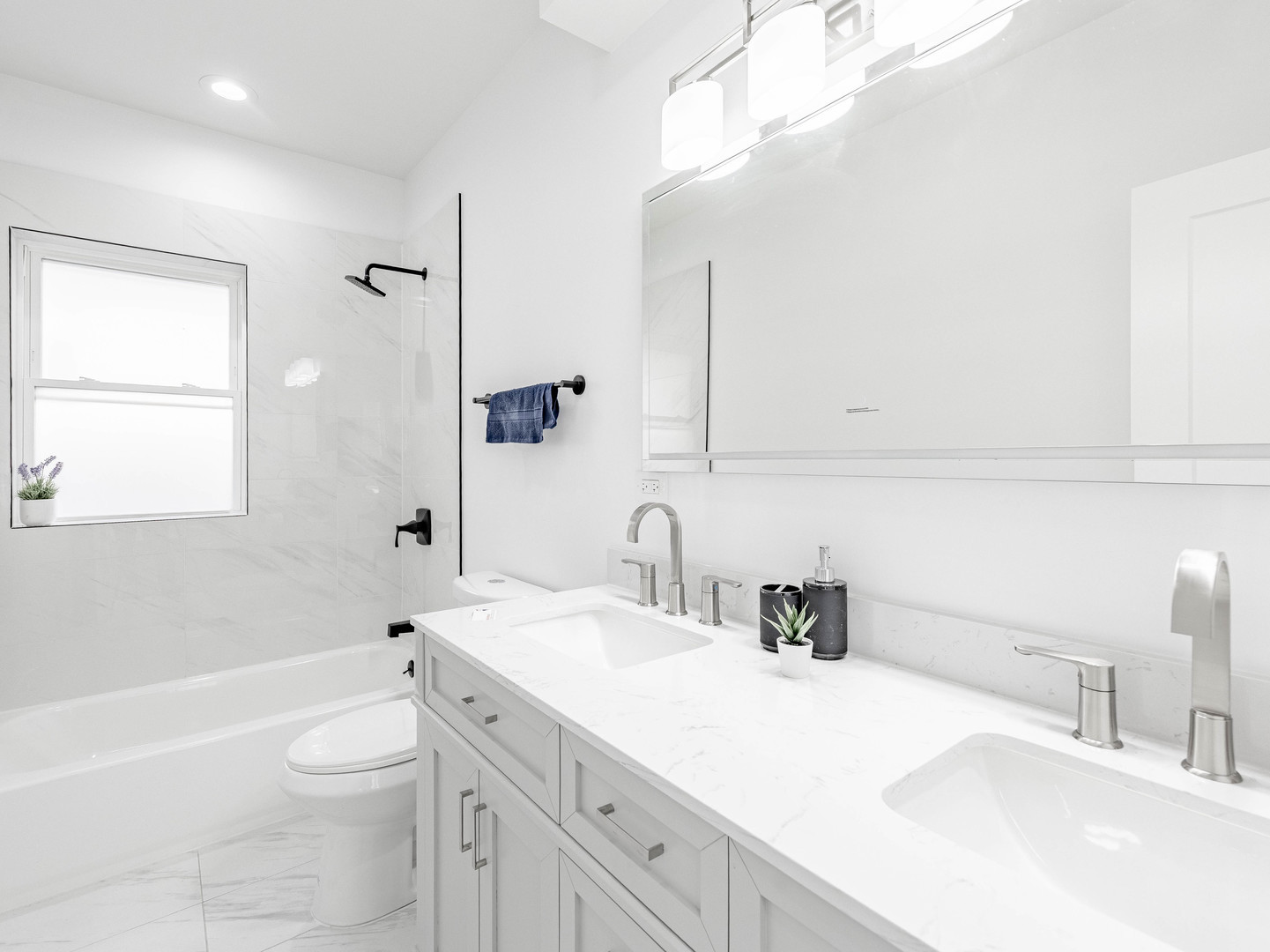 7755 South Wolcott Avenue Chicago, IL 60620 - Photo 9 of 39 a bathroom with a sink a toilet and shower