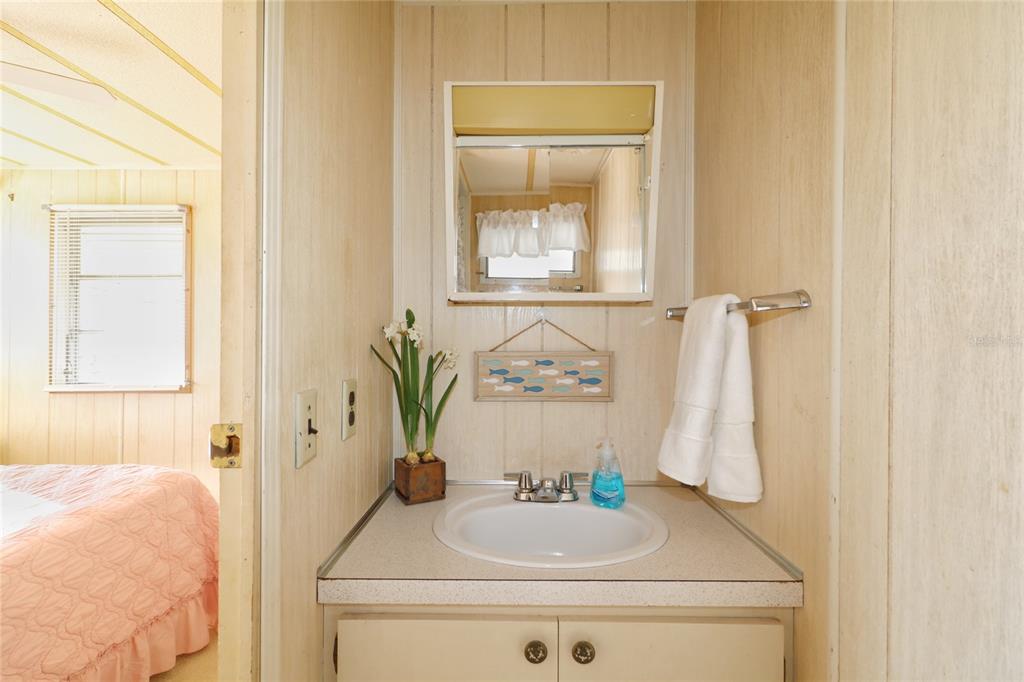 116 West St Johns Way Apollo Beach, FL 33572 - Photo 12 of 28 a bathroom with a sink and a mirror