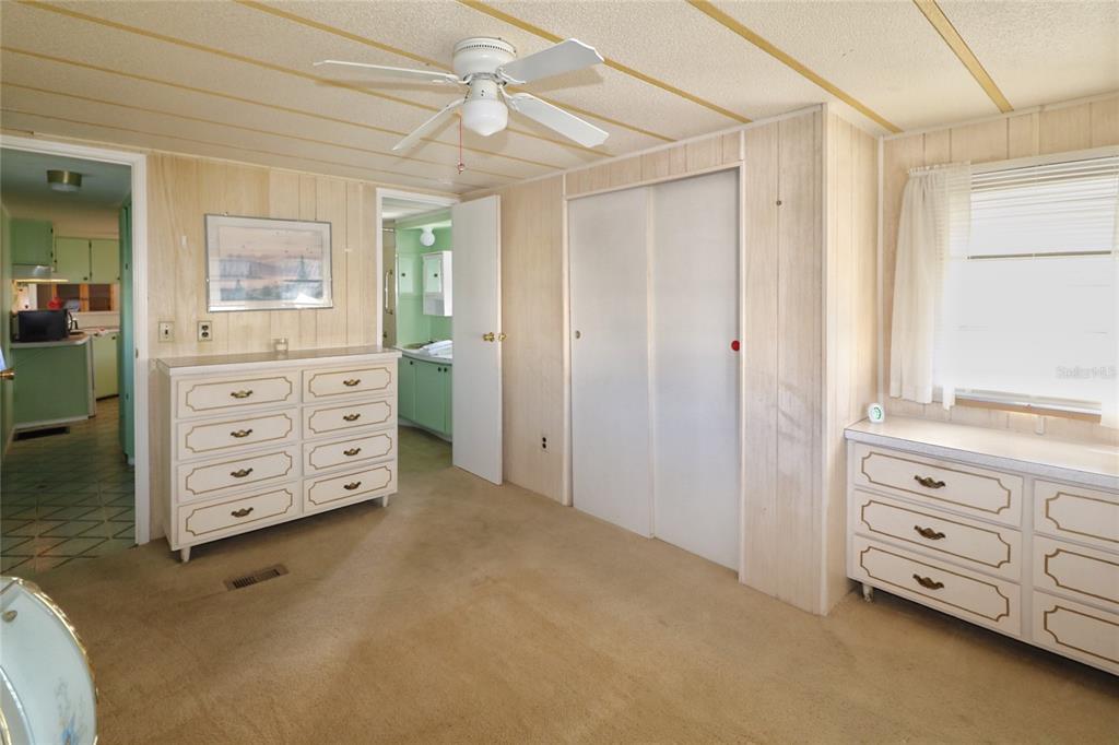 116 West St Johns Way Apollo Beach, FL 33572 - Photo 14 of 28 a room with closet and dresser