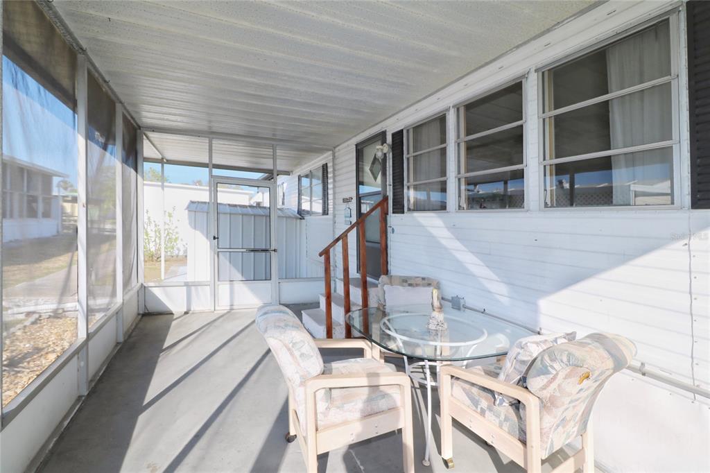 116 West St Johns Way Apollo Beach, FL 33572 - Photo 18 of 28 a dining room with furniture and a floor to ceiling window
