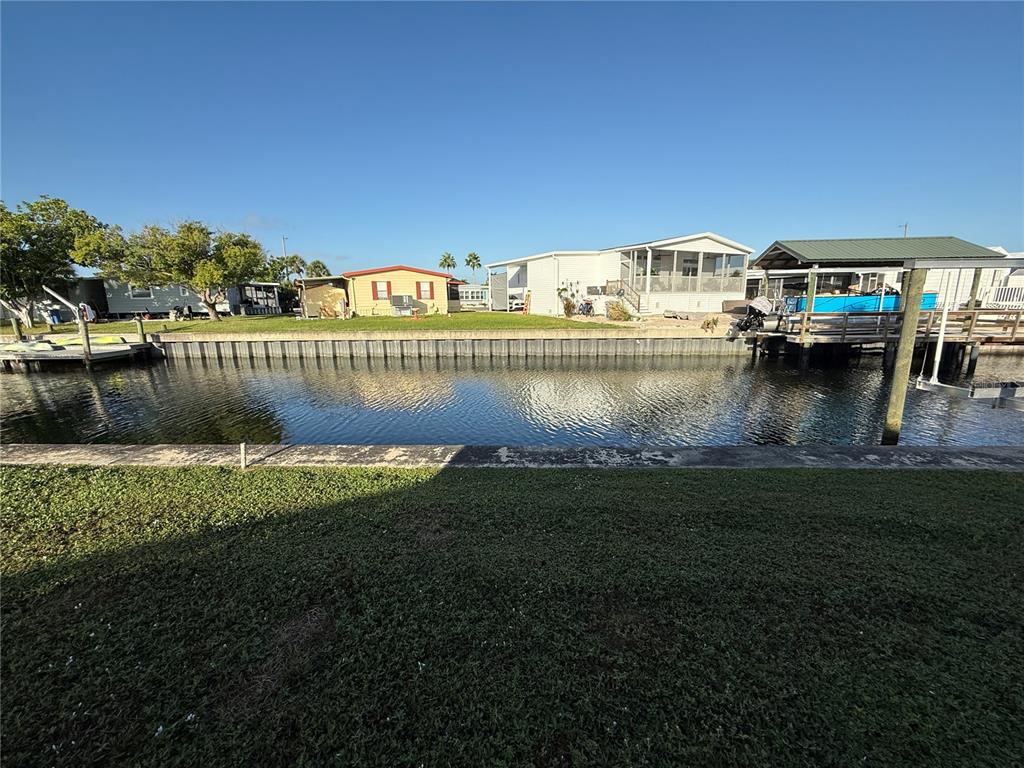 116 West St Johns Way Apollo Beach, FL 33572 - Photo 19 of 28 a view of swimming pool with outdoor seating and yard in back