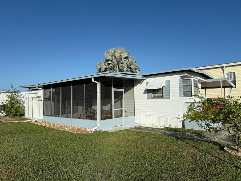116 West St Johns Way Apollo Beach, FL 33572 - Photo 2 of 28 a view of a house with a garden