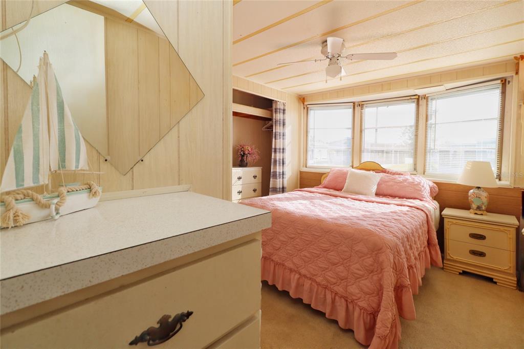 116 West St Johns Way Apollo Beach, FL 33572 - Photo 10 of 28 a bedroom with a bed and a dresser