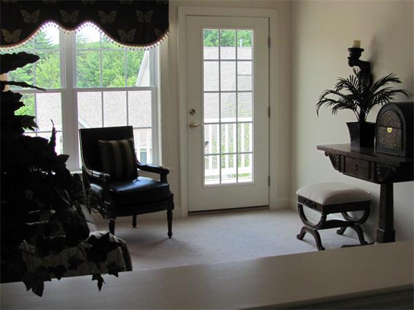 705 Autumn Ridge Drive, Unit 705 Ayer, MA 01432 - Photo 11 of 16 a living room with furniture tv and a window