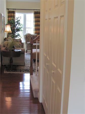 705 Autumn Ridge Drive, Unit 705 Ayer, MA 01432 - Photo 12 of 16 a view of entryway and livingroom with wooden floor