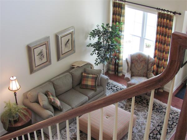 705 Autumn Ridge Drive, Unit 705 Ayer, MA 01432 - Photo 13 of 16 a living room with furniture and a potted plant