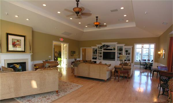 705 Autumn Ridge Drive, Unit 705 Ayer, MA 01432 - Photo 15 of 16 a living room with fireplace furniture and a flat screen tv