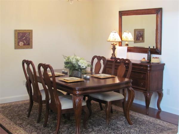 705 Autumn Ridge Drive, Unit 705 Ayer, MA 01432 - Photo 7 of 16 a dining room with furniture and window