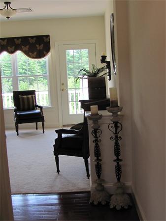 705 Autumn Ridge Drive, Unit 705 Ayer, MA 01432 - Photo 10 of 16 a living room with furniture a window and a flat screen tv