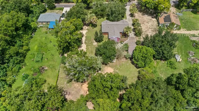 a backyard of a house with lots of green space