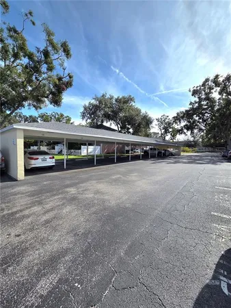 a view of a lake with houses in the back