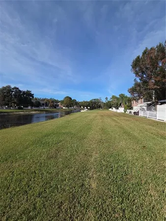 a view of a lake with houses in the back