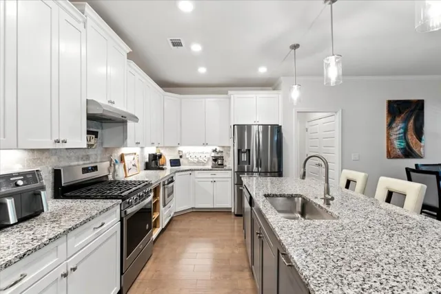 a bedroom with a bed and a couch