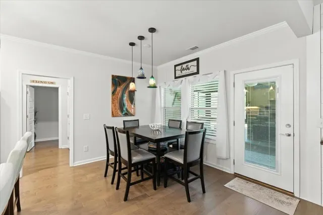 a bathroom with a granite countertop toilet sink and mirror