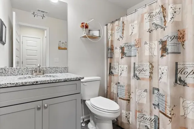 a view of hallway with wooden floor