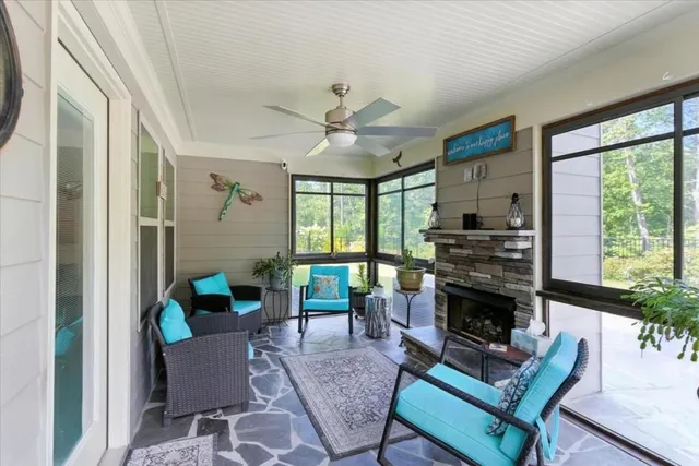 a view of a patio with table and chairs with wooden floor and stairs